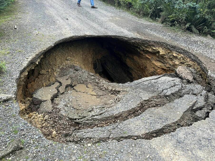 A large sink hole has opened on a rural road at Pyengana. Picture supplied