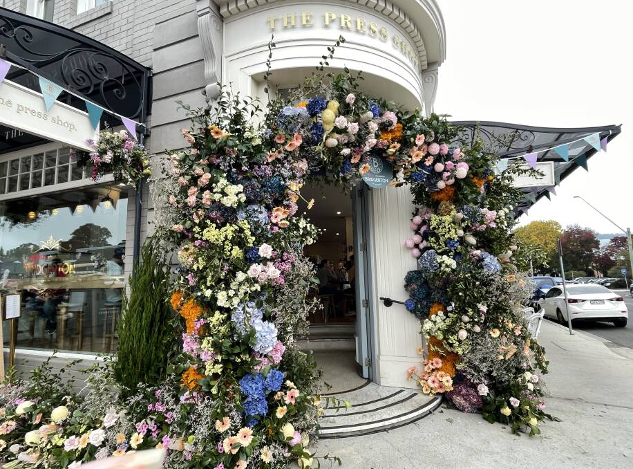 Flowers adorn the entrance to The Press Shop Cafe in Bowral. Picture by Briannah Devlin