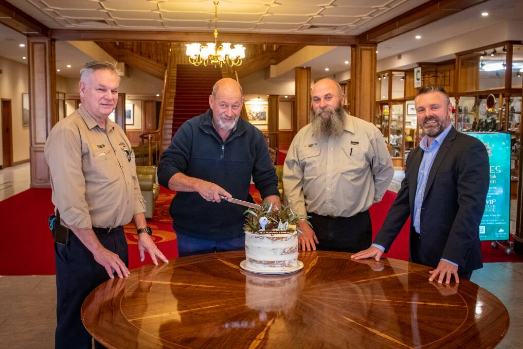 FOUR DECADES: Country Club Tasmania's maintenance electrician Andrew McDonald, golf course superintendent Steve Wilson, maintenance man Michael and general manager Ross Hannah cutting a birthday cake. Picture: Paul Scambler