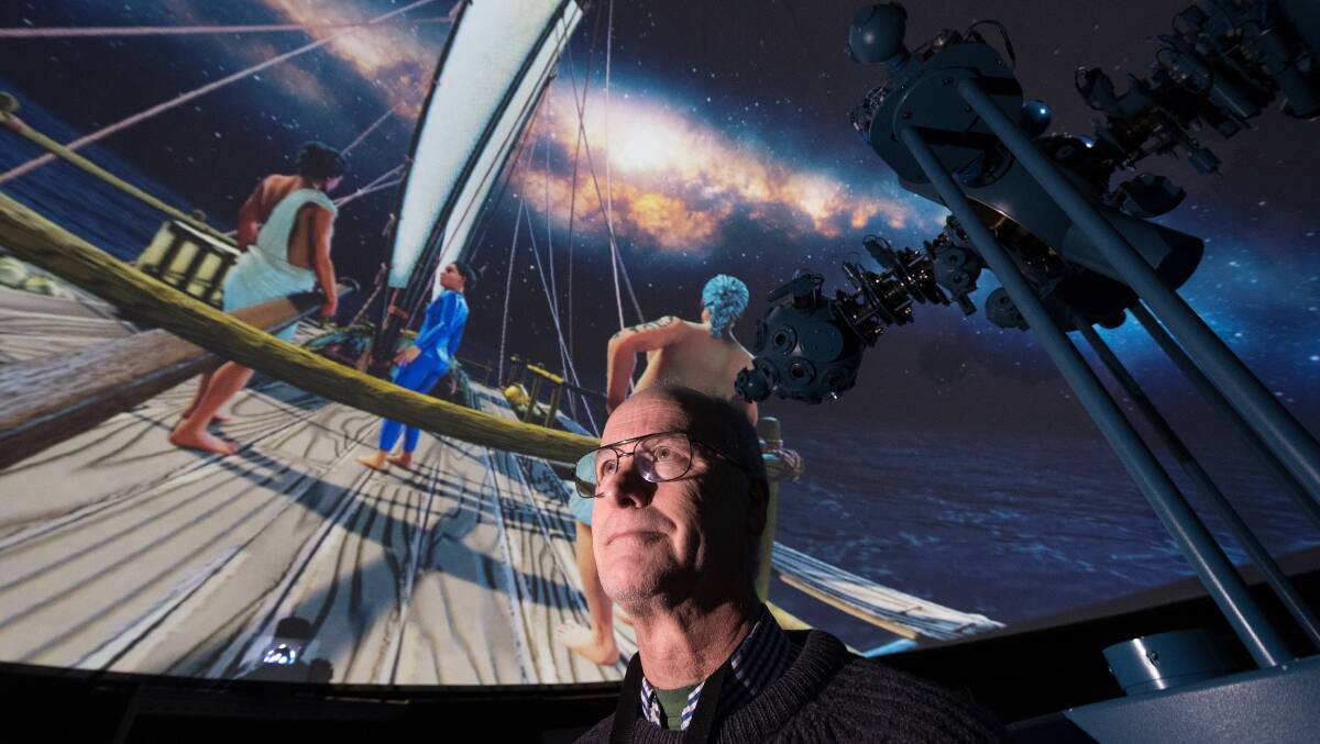 QVMAG Planetarium officer Chris Arkless with a still from the new film Nga Tohunga Whakatere - The Navigators. Picture: Phillip Biggs
