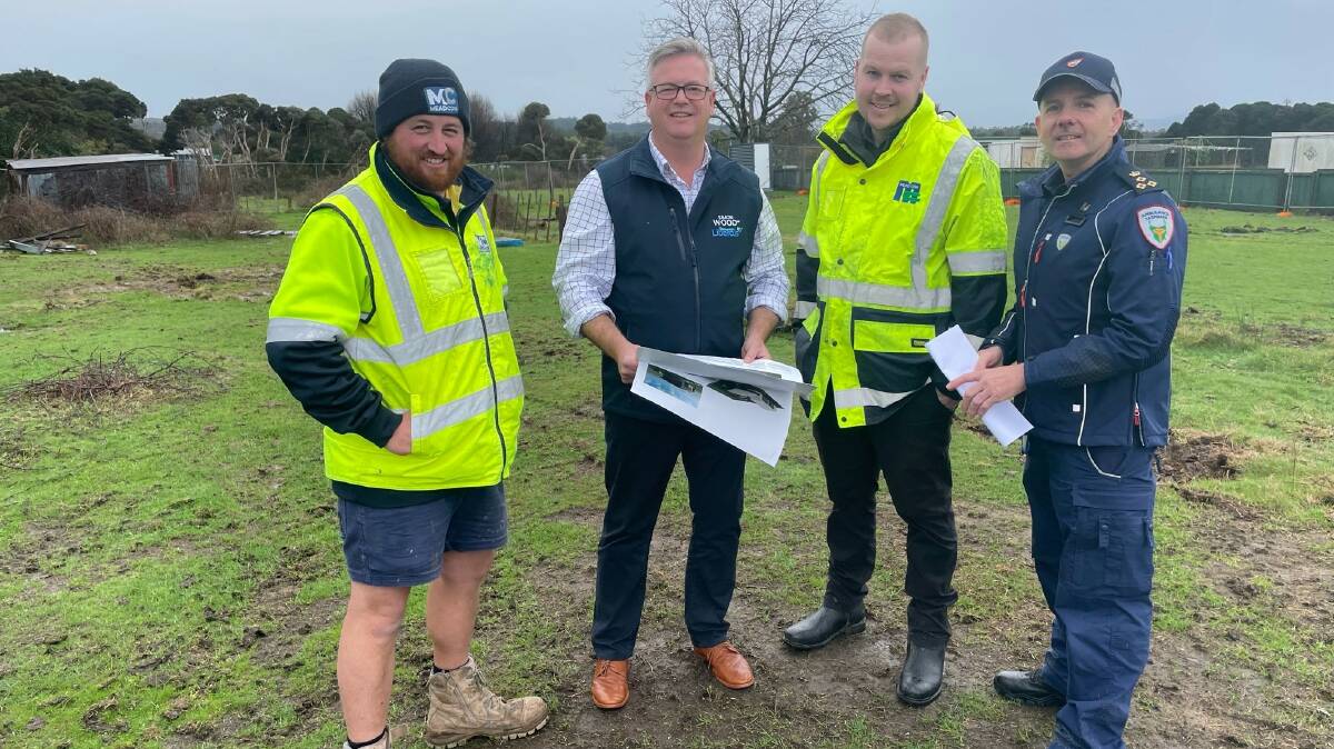 HEALTH SERVICE: Liberal member for Bass Simon Wood, Ambulance Tasmania assistant director of operations Al Shepherd and contractors from Mead Con at Beaconsfield. Picture: Supplied