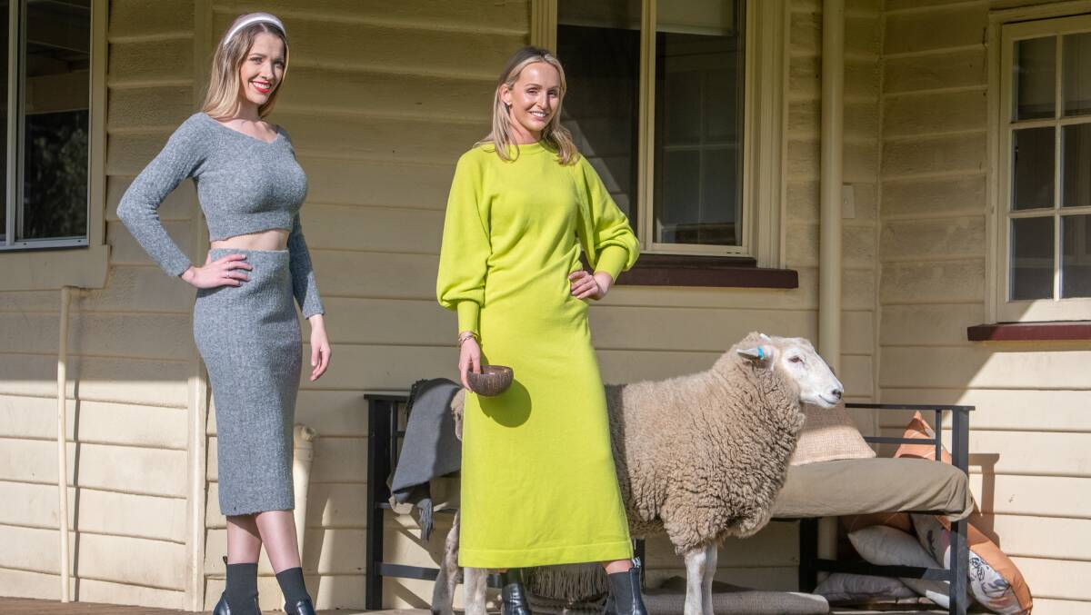 ON SHOW: Models Chelsea Freestone and Courtney Laskey previewing clothes from the Australian Wool Innovation Collection for this winter's Campbell Town Show, with "Bruiser Woods" the ram. Picture: Paul Scambler