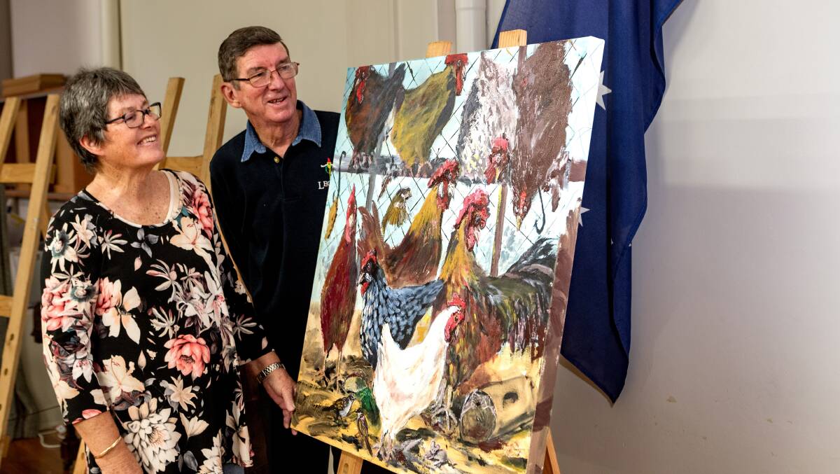 LOCAL TALENT: Launceston Art Society's Carlene Bullock and Terry Byrne display local artists at an exhibition at Legacy House. Picture: Phillip Biggs
