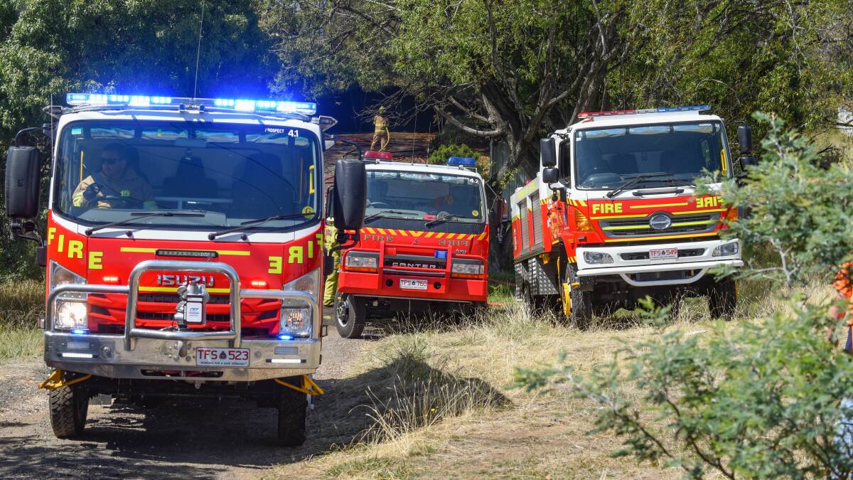 Three Tasmanian Fire Service tankers at Travellers Rest. Picture by Paul Scambler