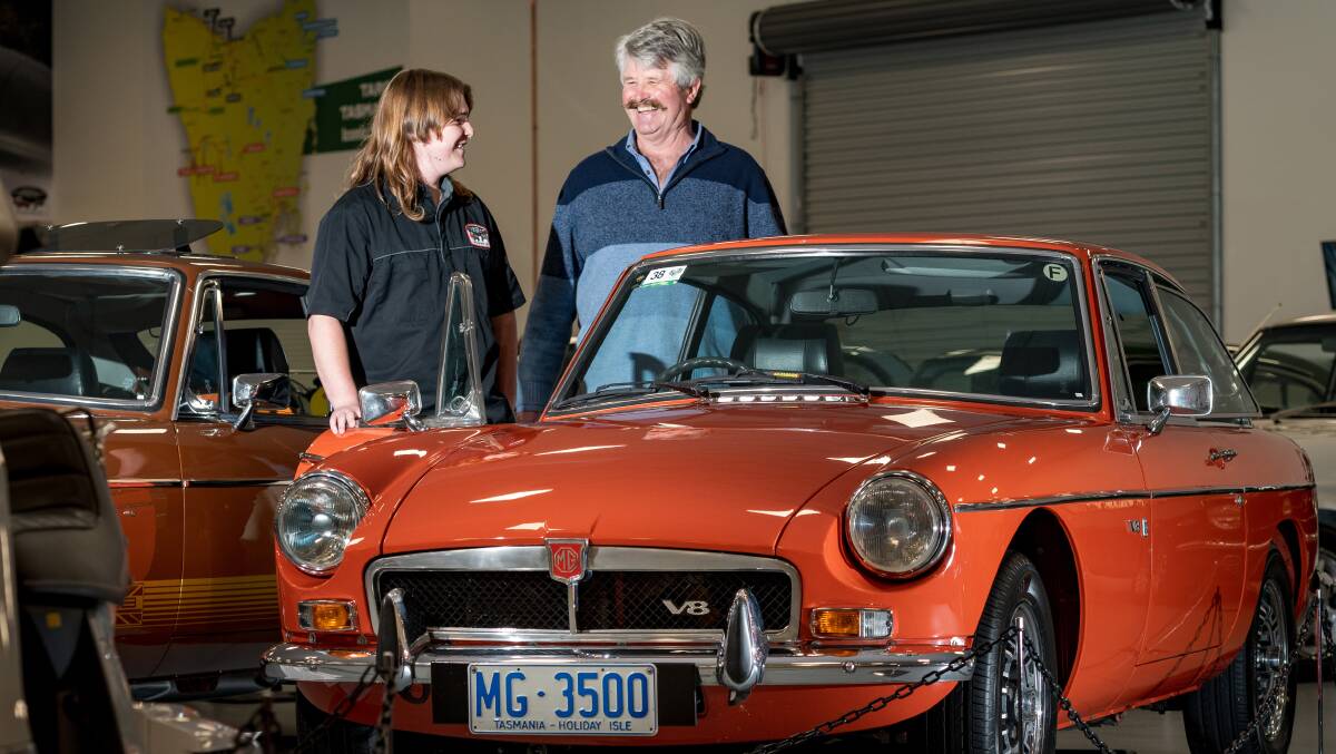 ON YOUR MARQUE: National Automobile Museum of Tasmania assistant Finn Bosworth and MG Car Club of Tasmania past president Phillip Tilley with a 1978 MGB GT. Picture: Phillip Biggs
