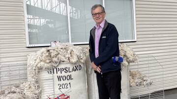 GENEROSITY: Modiano Australia wool buyer Lou Morsch with the top priced bale of the charity auction.  Photo supplied by Mal Nicholls.