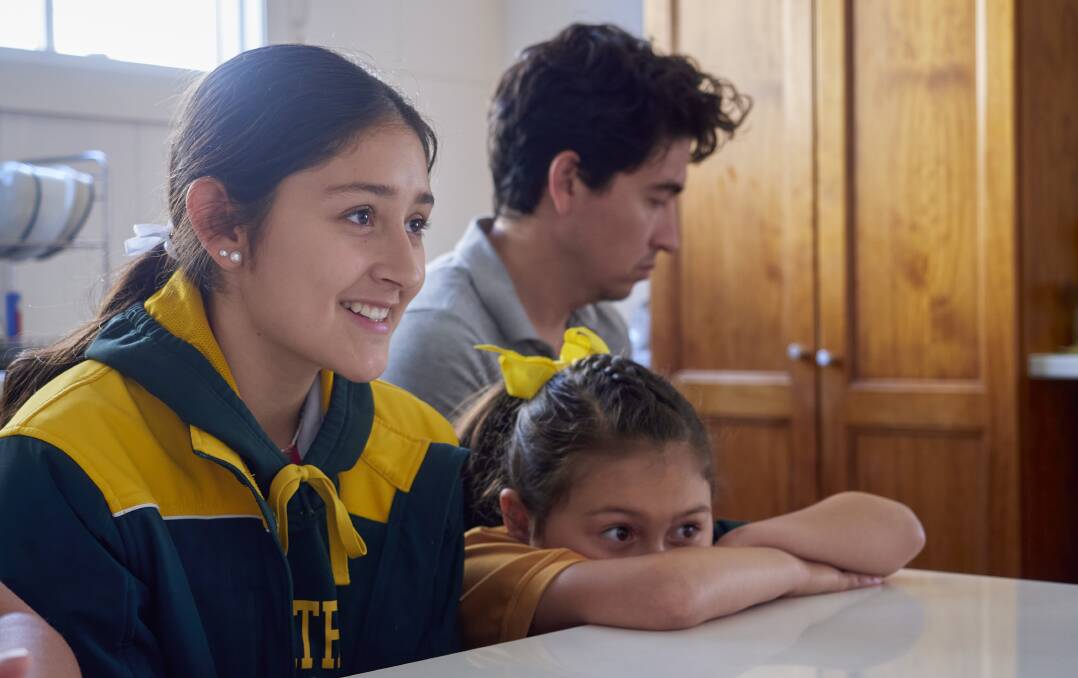 Maria Penuela-Castillo, 14, Janah Penuela-Castillo, 7 and Cesar Penuela. Picture by Rod Thompson. 
