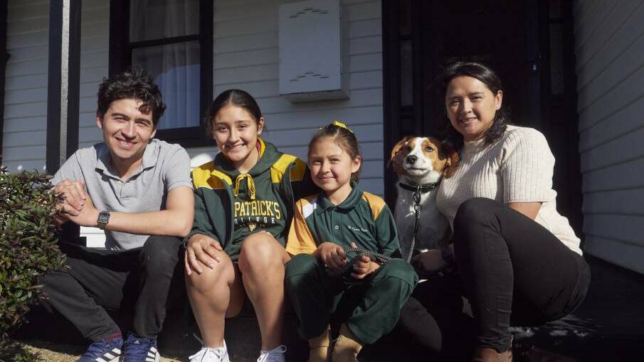 Cesar Penuela, Maria Penuela-Castillo, 14, Janah Penuela-Castillo, 7, and Claudia Castillo with the family dog at their Invermay home. Picture by Rod Thompson.