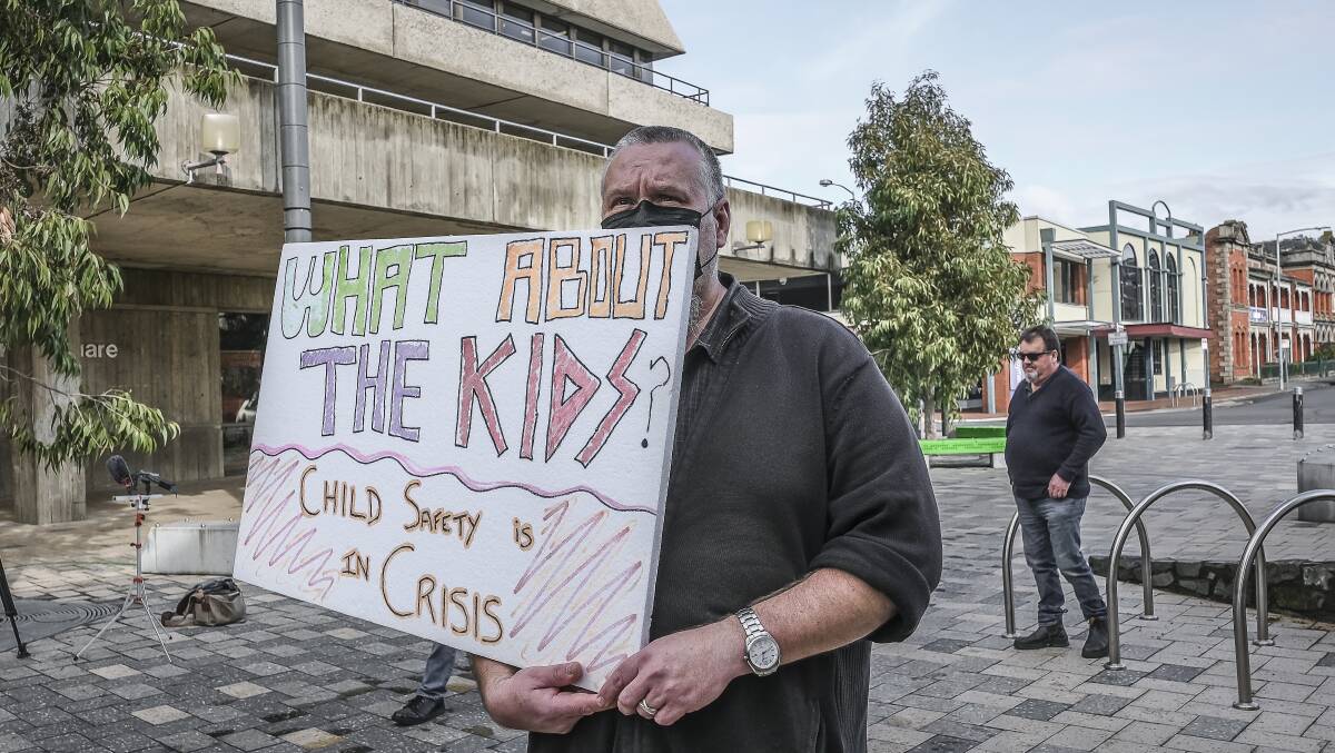 Strike: A man holding signage which reads "What about the kids?". Picture: Craig George