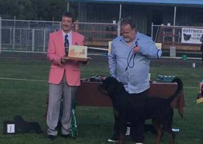 James Brady receiving an award at a dog show competition with champion rottweiler Morro. Source: Facebook 