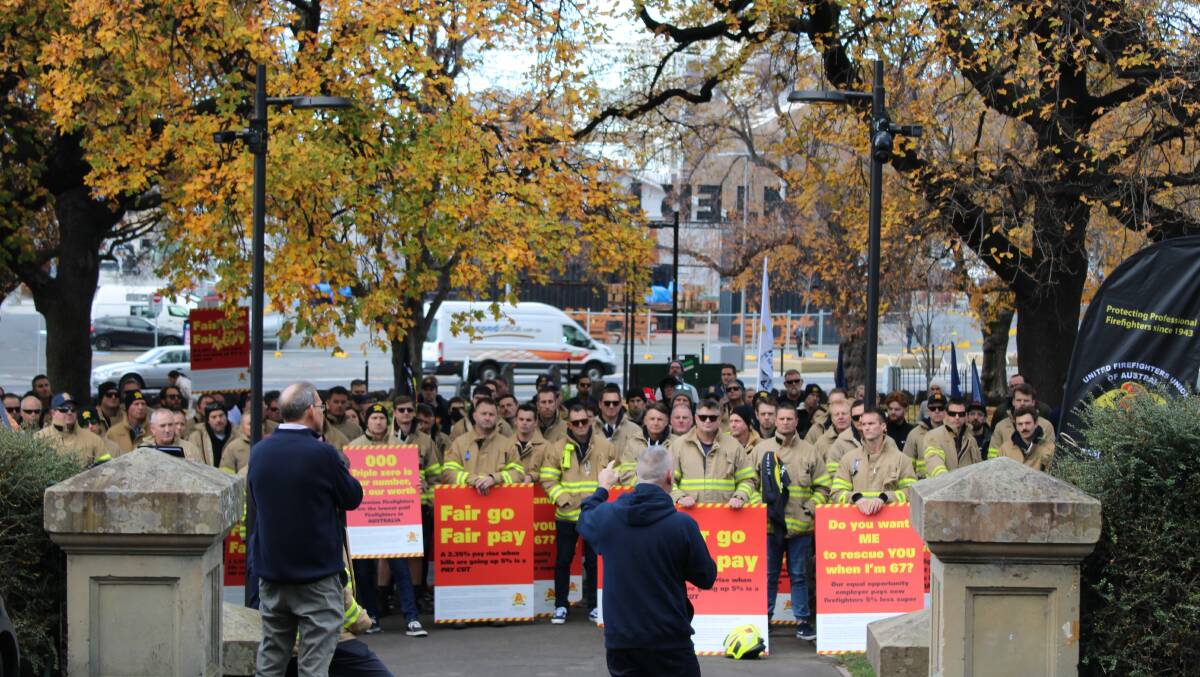 PAY DISPUTE PROTEST: Firefighters at the protest outside State Parliament on Wednesday.