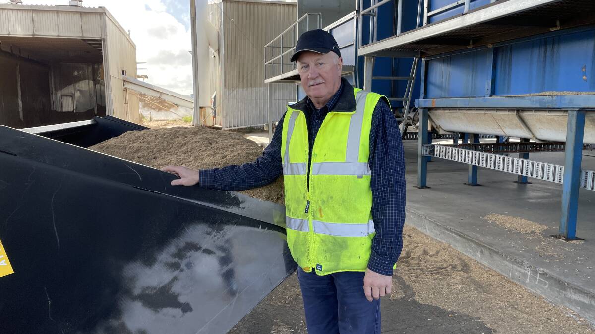 Former Senator Shayne Murphy standing before a pile of the wood waste used to make the pellets. Picture: Ben Seeder