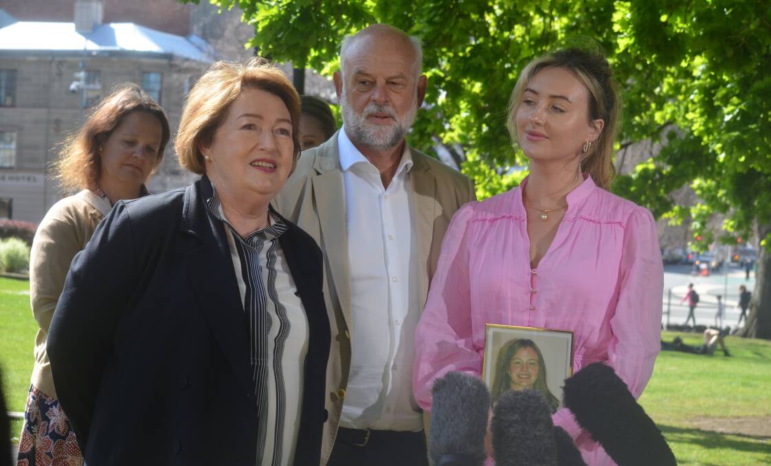 Anne, Craig and Amanda Duncan with a photo of Zoe Duncan on September 26 in Hobart. Picture by Matt Maloney