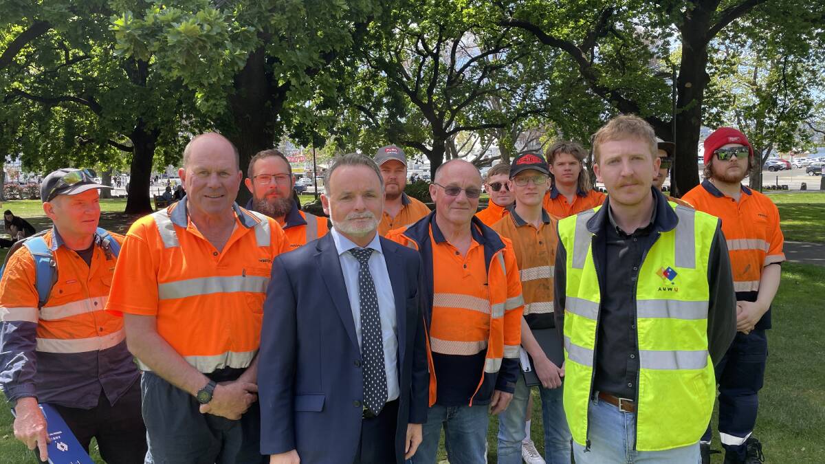 Franklin MHA David O'Byrne and AMWU organiser Jacob Batt with Metro mechanics from Launceston and Hobart. Picture by Ben Seeder