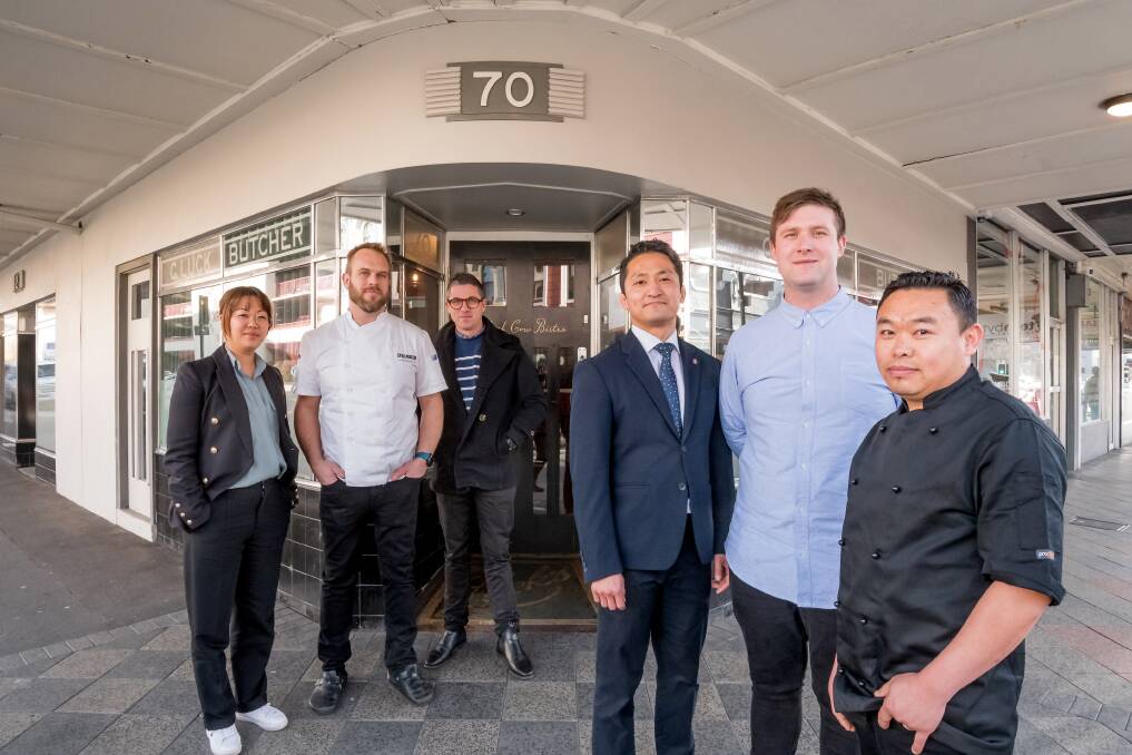 Black Cow former owners Bianca Welsh, Craig Will and James Welsh, pictured with new owners Ethan Han, Tom Tyler and Nabin Gurung. Picture: Phil Biggs