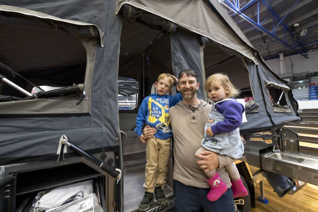 Launceston father of two, Nick Morgan, with Dylan Morgan, 5, and Alice Morgan, 2, at the Tasmanian Outdoor Boat and Caravan Show. Picture by Phillip Biggs