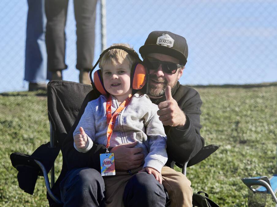 Hamish Woodwiss, 4, and Nathan Woodwiss watch all of the motorsport action at the raceway. 