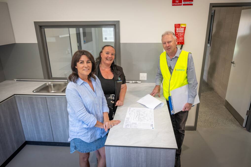 Disability Services Minister Jo Palmer with Choice Support Tasmania operations manage Crystal Walker and Shane Mann & Associates architect Shane Mann in the kitchen of a new Special Intensive Support Unit for NDIS recipients in Launceston. Picture by Paul Scambler 
