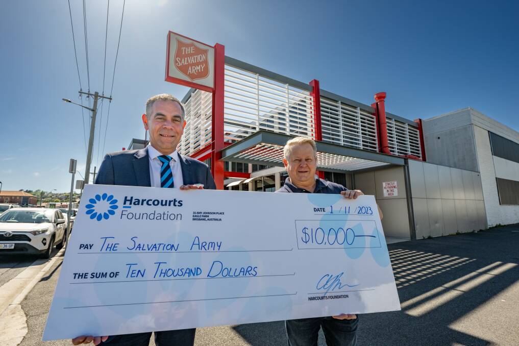 Harcourts Launceston director Jeremy Wilkinson and Salvation Army business manager James Gray with the cheque for $10,000 at the Elizabeth Street site. Picture by Paul Scambler 
