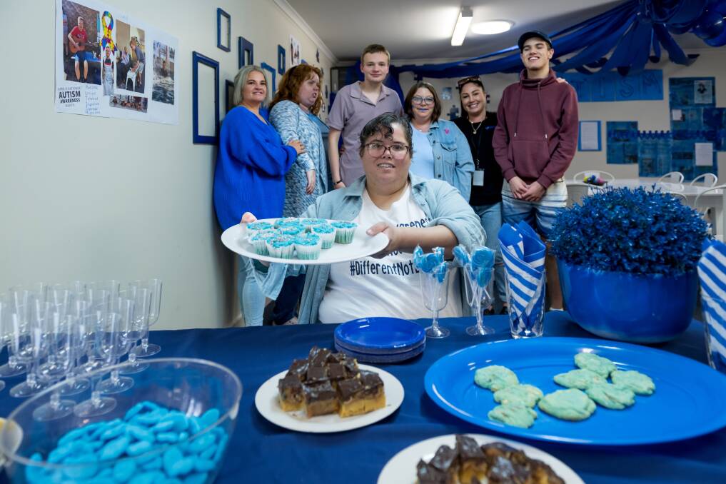 Veronica Tunks (foreground) at First Class Support Services open day for Autism Awareness Month. Picture by Phillip Biggs 