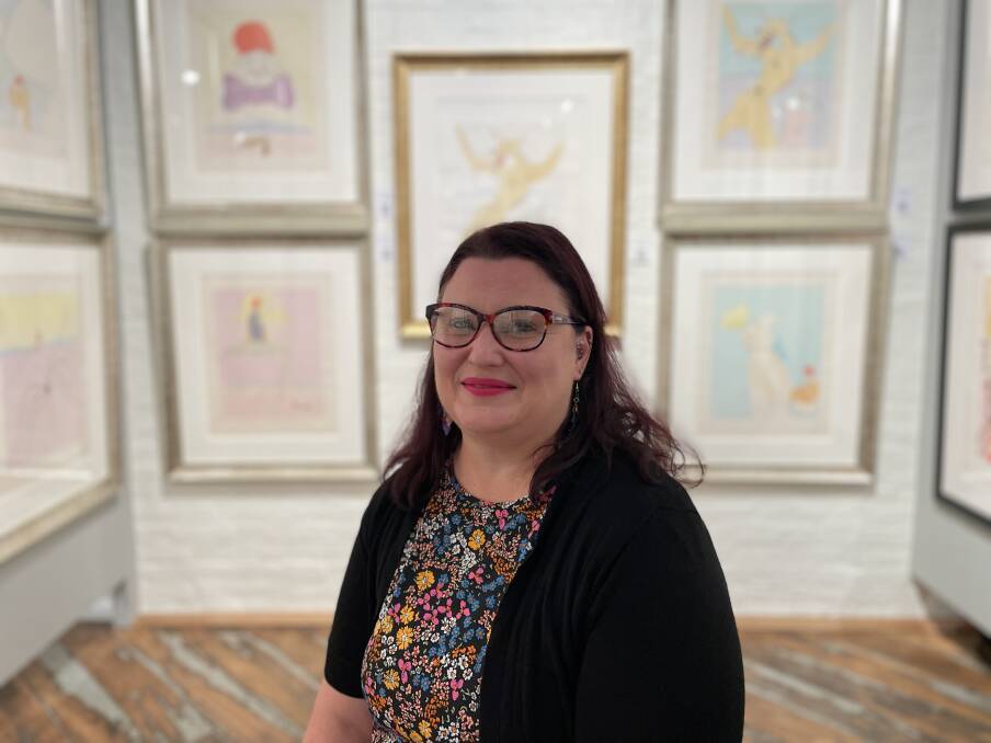 dAda mUse collections manager Amy Bartlett surrounded by Dali works. Picture by Duncan Bailey