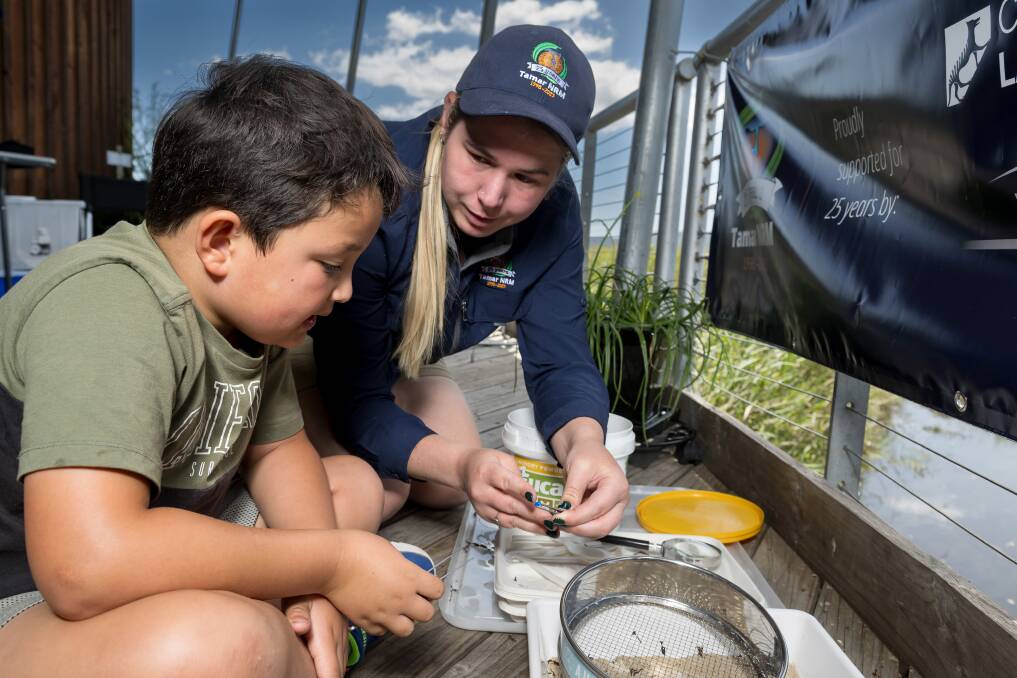 Tamar NRM projects officer Megan Grant teaches Eddy Peach about plastics at the Tamar Island Wetlands Centre. Picture by Phillip Biggs