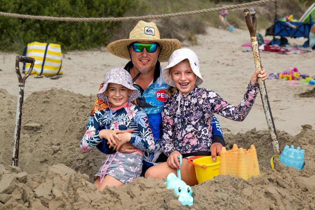 Sean Collier of Bridport with Anika and Amali, building a large sandcastle at the Bridport Splash. Pictures Phillip Biggs