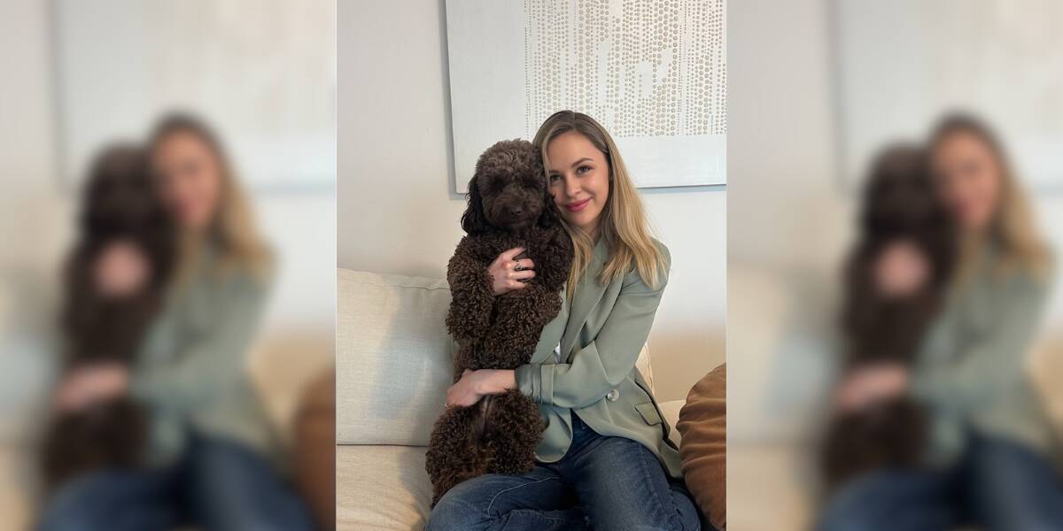 Holly was forced to separate with her dog in order to find a rental. Here she is pictured with her labradoodle, Frankie. Picture supplied