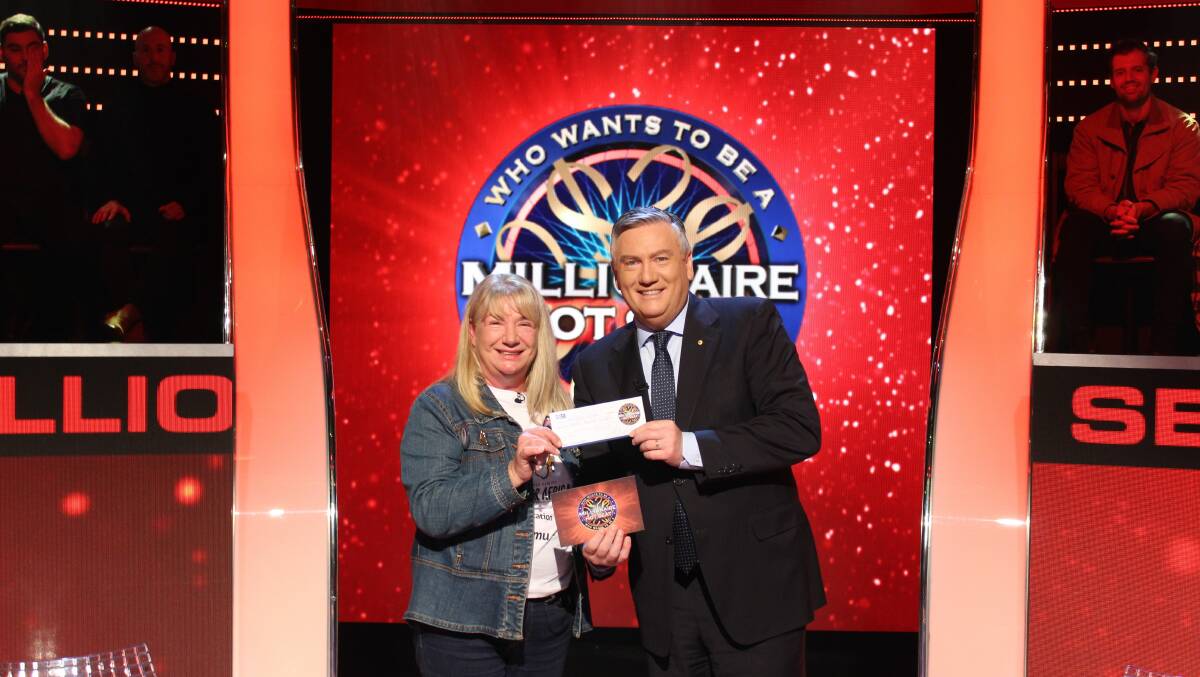 Gaylene Slater recieving her winnings from host Eddie McGuire. Picture: supplied.