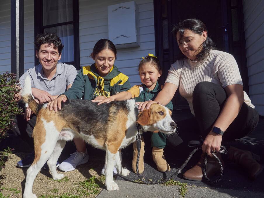 Cesar Penuela, Maria Penuela-Castillo, 14, Janah Penuela-Castillo, 7, and Claudia Castillo with the family dog at their Invermay home. Picture by Rod Thompson.