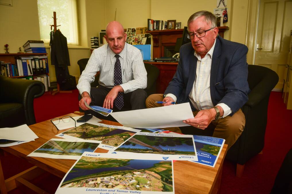 Former Tasmanian Premier Peter Gutwein and former Infrastructure Minister Rene Hidding look over details about the second Tamar River bridge in 2018. Picture by Paul Scambler