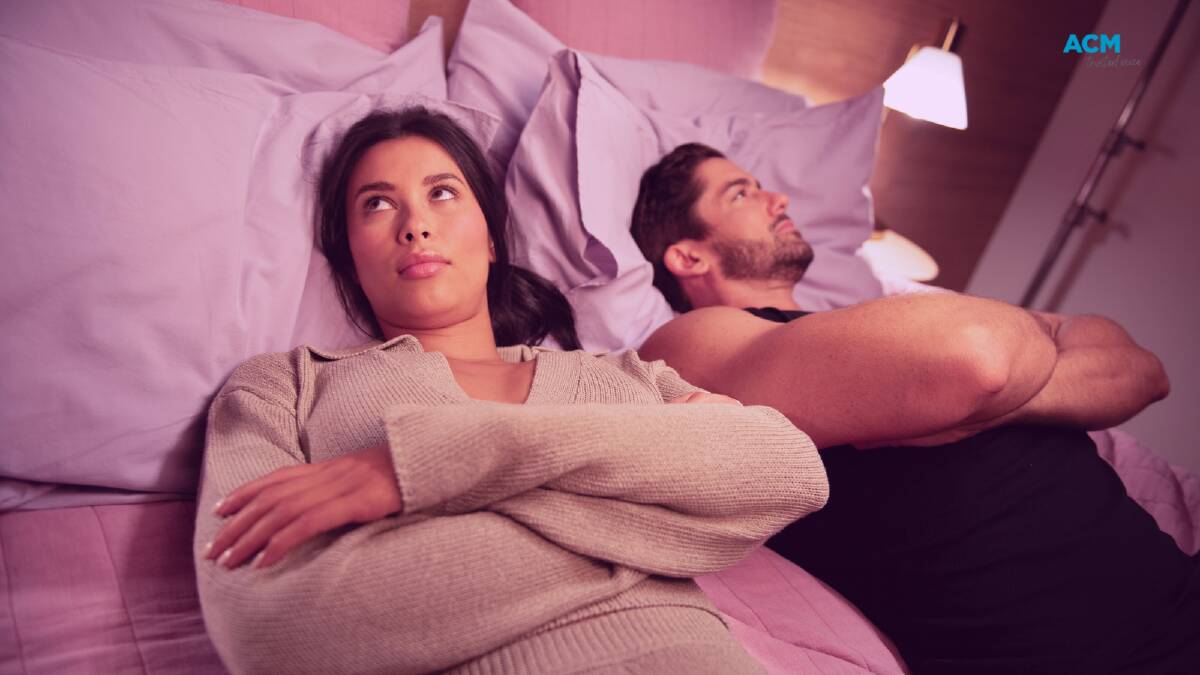 Evelyn Ellis and Duncan James feign frustration at each other while lying in bed. Picture supplied