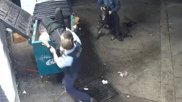 Officers pull alleged armed robber from Sydney dumpster. Picture Nine
