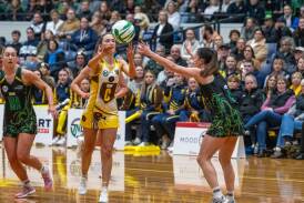 Cavaliers' Keely Atkinson defends Hawks' Lydia Coote in the TNL 2023 grand final. Picture by Paul Scambler