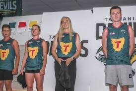 Jack Blackwell, Aya Cottam, Emily Mckinnell and Liam Jones present the guernseys at the Tasmania Football Club launch. Picture by Craig George