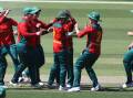 Tasmanian Tigers wicket-keeper Emma Manix-Geeves is congratulated by her teammates. Picture by Rick Smith