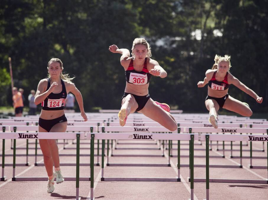 Isabella Wing during the under-18 100-metre hurdles at the Tasmania Athletics Championships.