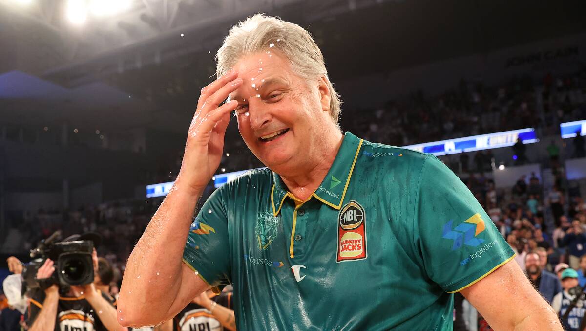 Tasmania JackJumpers coach Scott Roth is showered with Powerade after winning the NBL championship series against Melbourne United. Picture by Kelly Defina/Getty Images