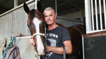 Legendary Tasmanian horse trainer Gary White, pictured with Heaven's Bonus, has retired following a career spanning five decades. Picture on Gary White Racing Facebook