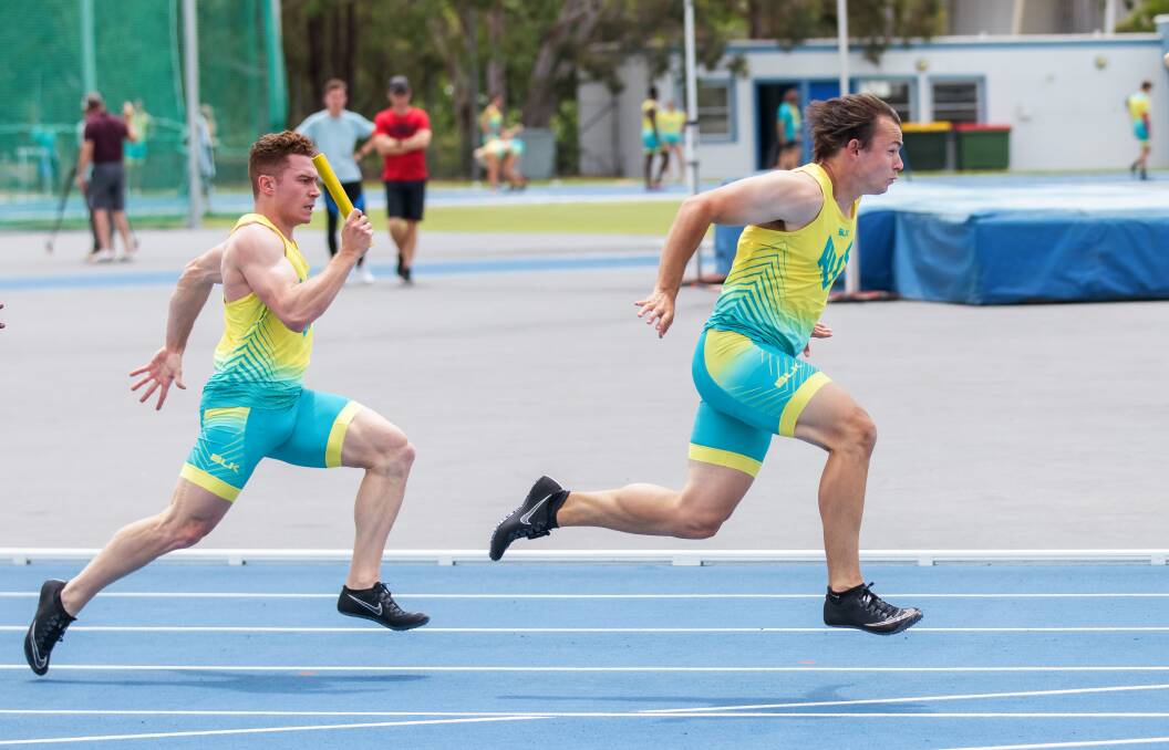 Jack Hale (right) in relay training with the Australian team. Picture by Sitthixay Ditthavong
