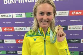 Ariarne Titmus with one of her gold medals from the 2022 Commonwealth Games. Picture TIS