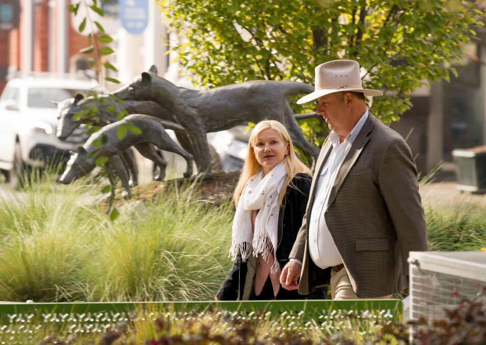 Facing extinction ... Tasmanian MPs Lara Alexander and John Tucker walking past the thylacine statues in Launceston's Civic Square after announcing their resignations from the Liberal Party. Picture by Phillip Biggs