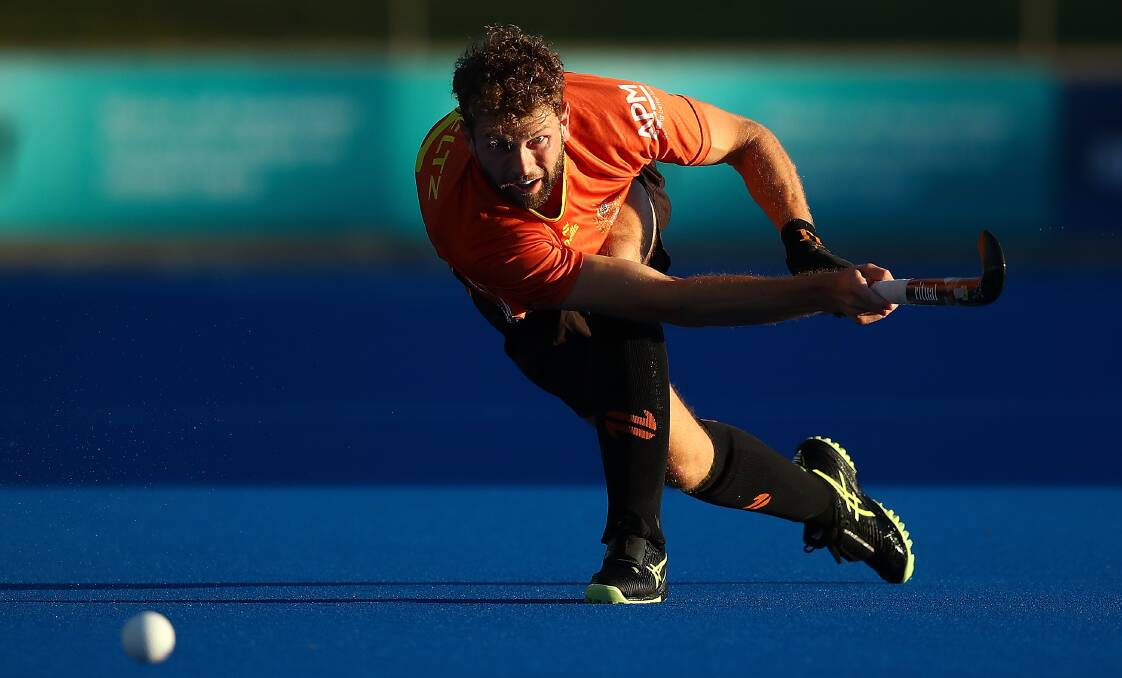Josh Beltz sprays a pass for the Kookaburras against India earlier this month. Picture by Hockey Australia