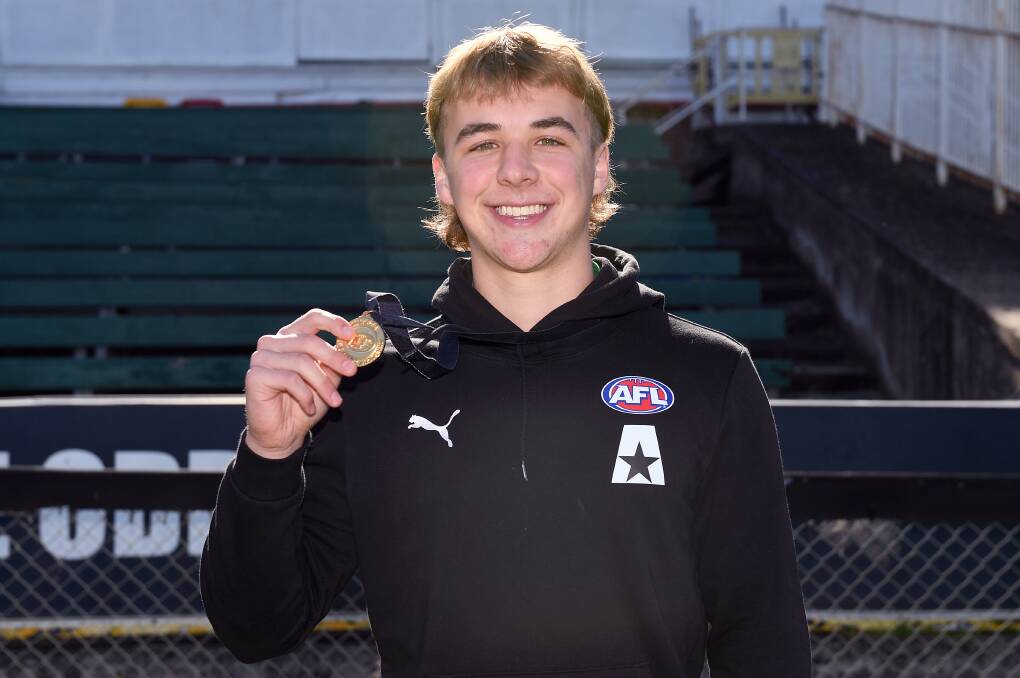 Allies midfielder Ryley Sanders with the 2023 Larke Medal. Picture by Morgan Hancock/AFL Photos