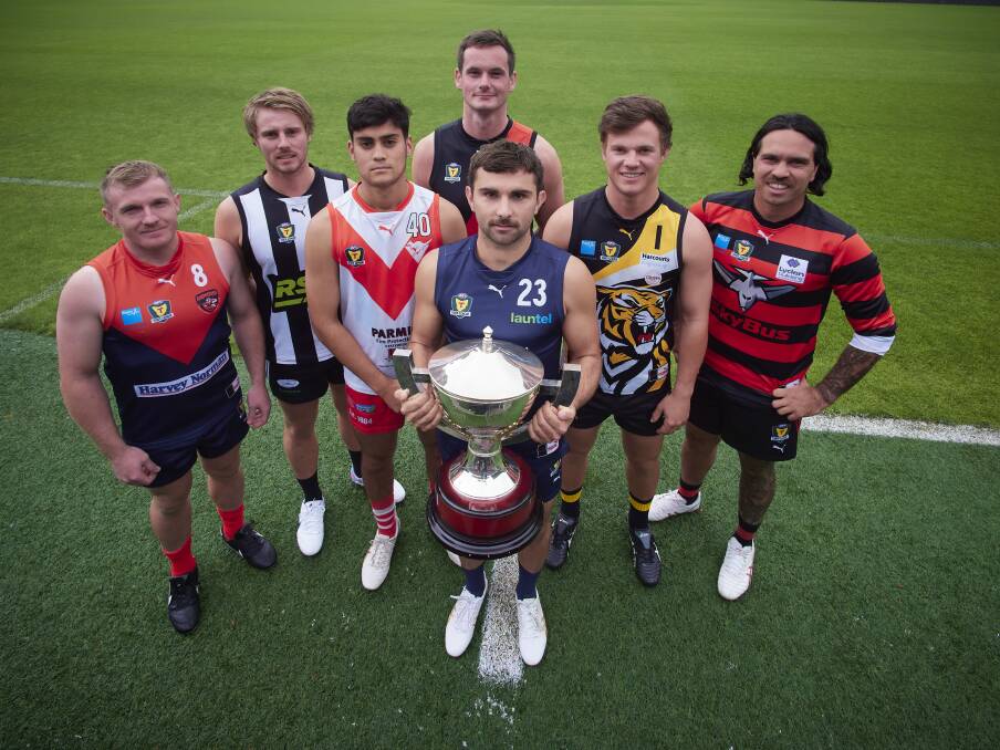 North Launceston's Alex Lee (back) and Launceston's Brodie Palfreyman (front) with other club representatives at the State League's season launch in March. Picture by Rod Thompson