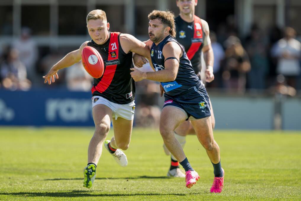 North Launceston's Blade Sulzberger and Launceston's Brodie Palfreyman
during the teams' State League match at Windsor Park. Picture by Phillip Biggs