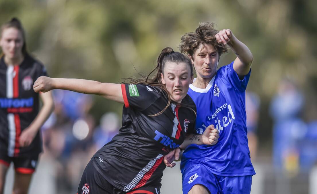 Launceston United's Katie Hill and Clarence's Zoe Nicholls when the sides met in 2021. Picture by Craig George