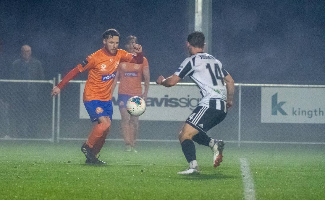 Riverside's Liam Poulson and Launceston City's James Hawes in action during one of last season's Northern NPL derbies. Picture by Paul Scambler