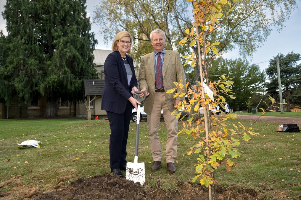 Senator Wendy Askew and Councillor Richard Archer plant an English oak in honour of Charles III. Picture by Phillip Biggs. 