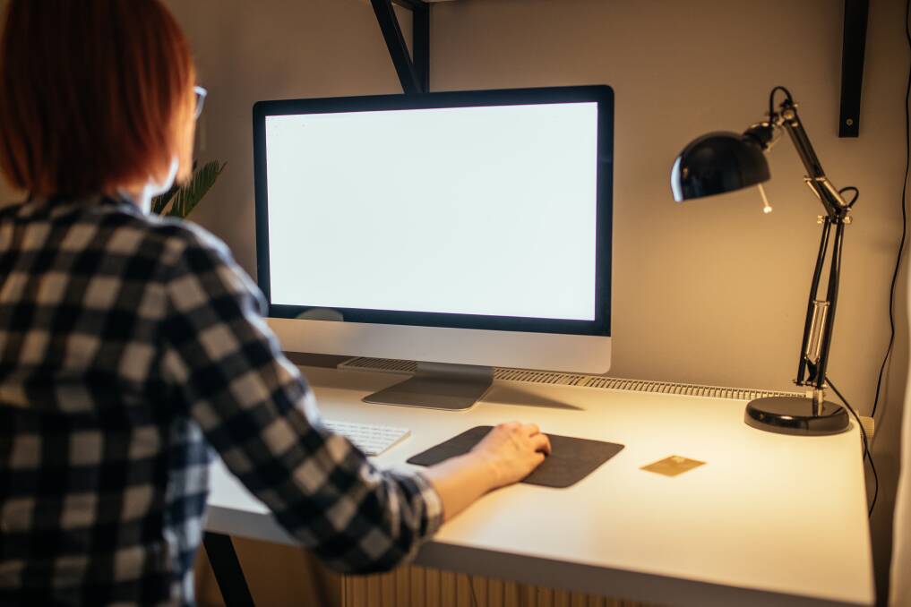A woman at her computer. Picture from file. 